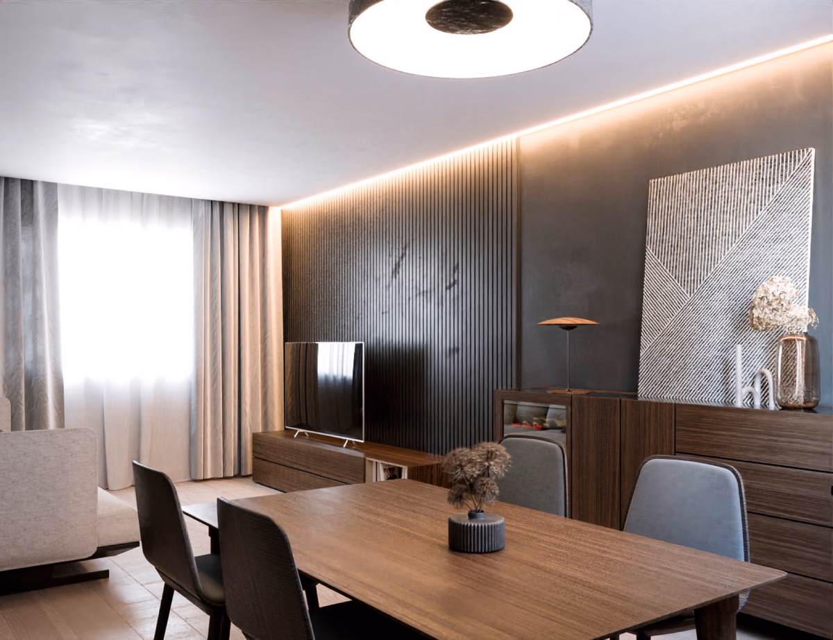 Salón de la vivienda Falcó, con iluminación puntual y mobiliario de firma.
