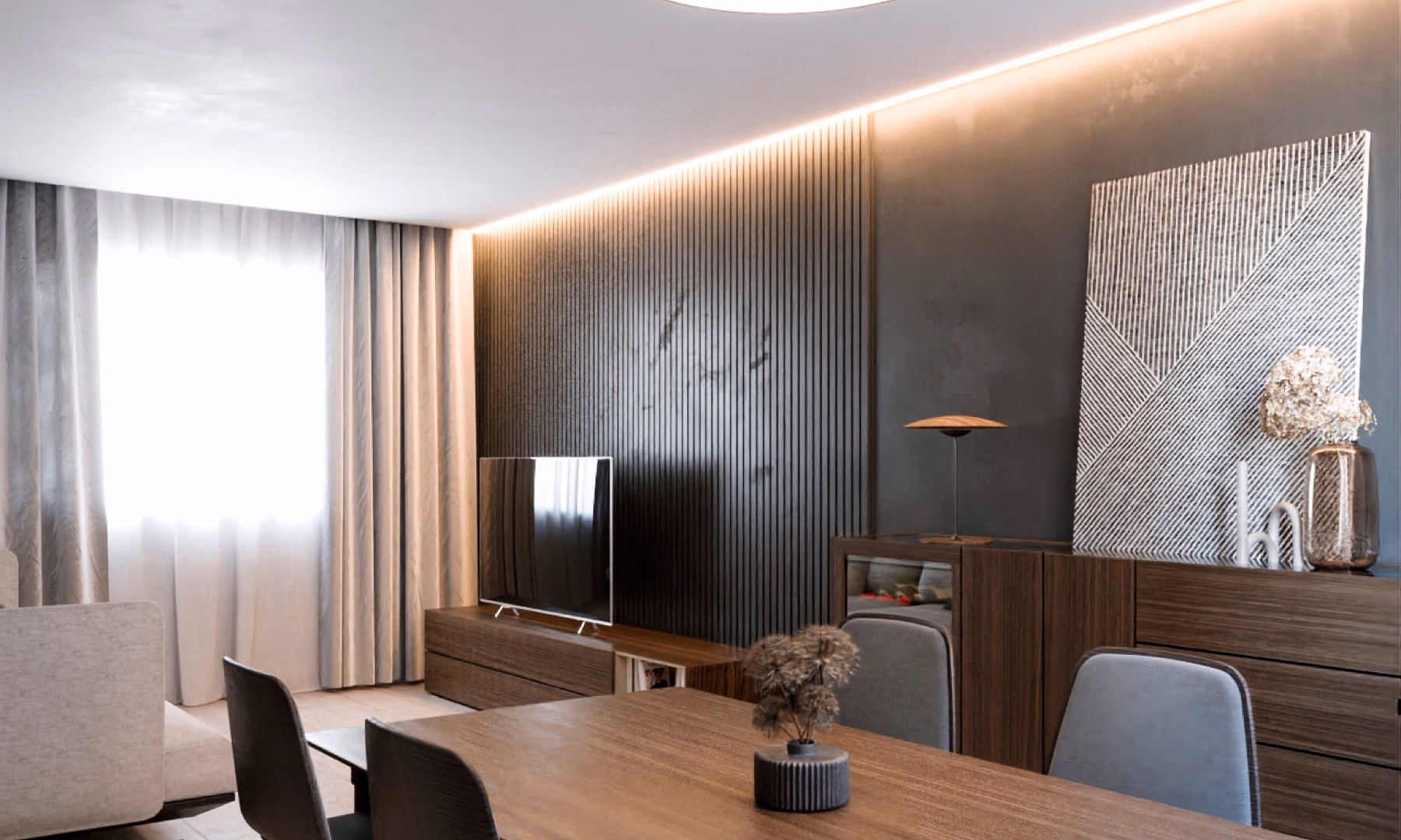 Salón de la vivienda Falcó, con iluminación puntual y mobiliario de firma.