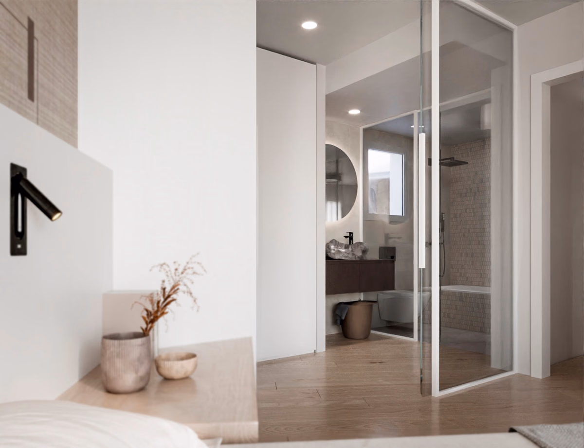 Vestidor de la suite principal, con carpintería a medida en madera y luz indirecta.