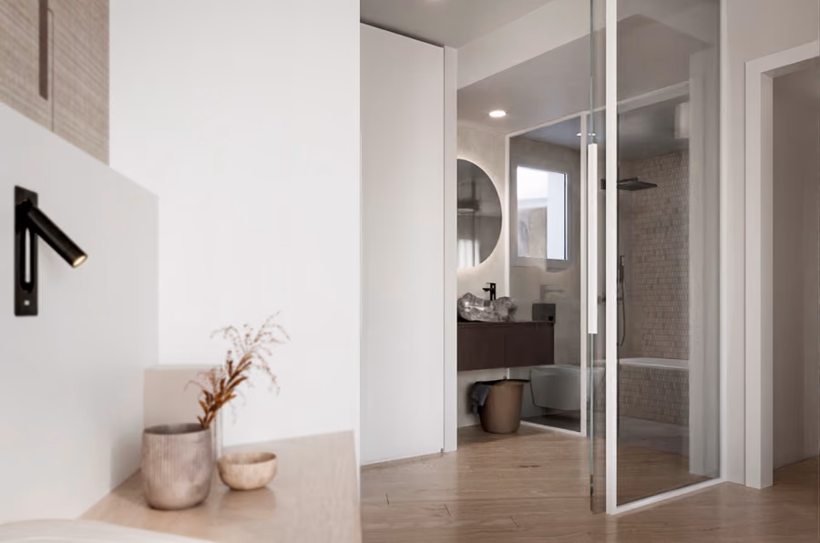 Vestidor de la suite principal, con carpintería a medida en madera y luz indirecta.