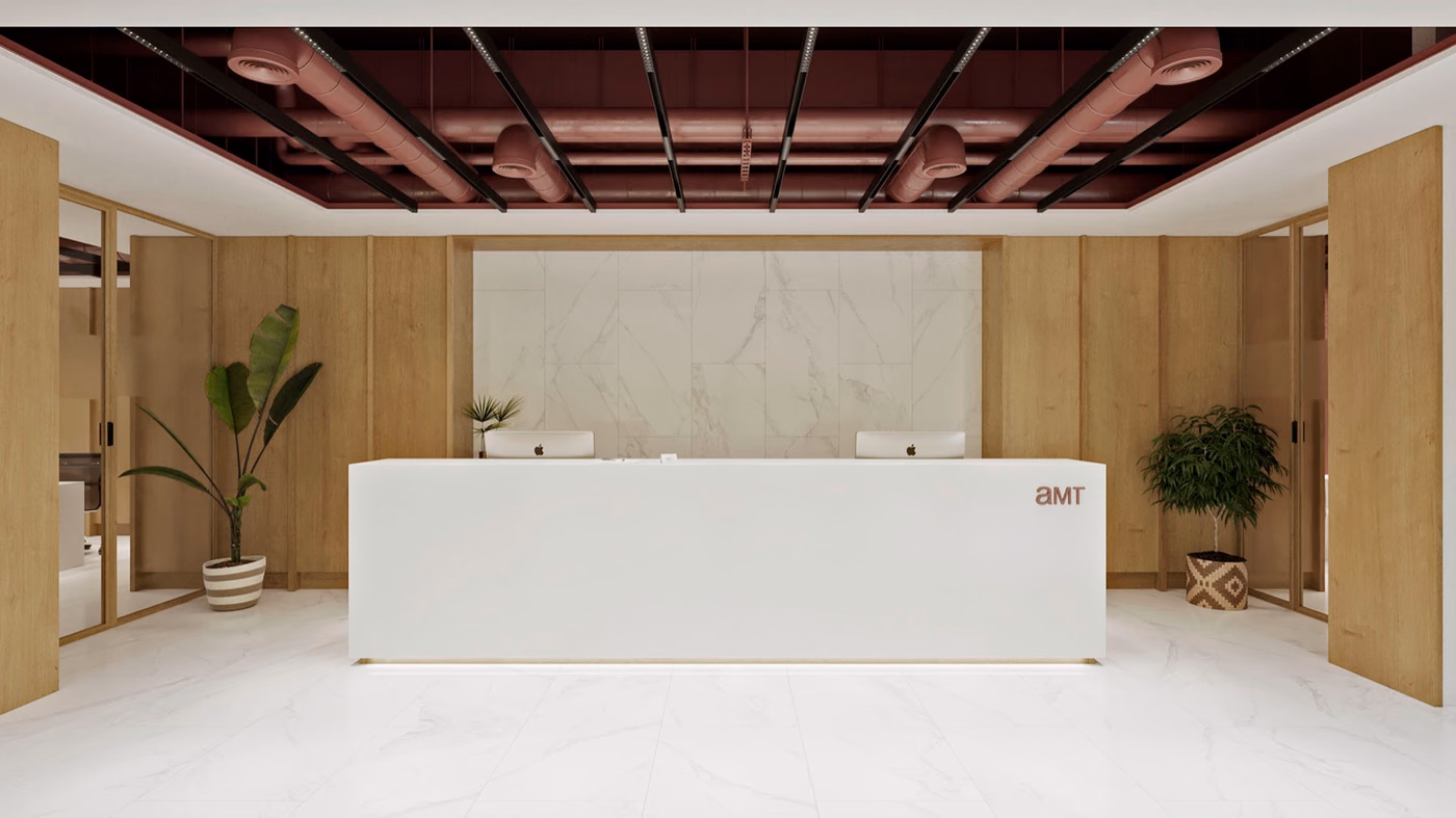 Oficinas AMT: recepción y espacio de trabajo diáfano con equipamiento diseñado a medida.