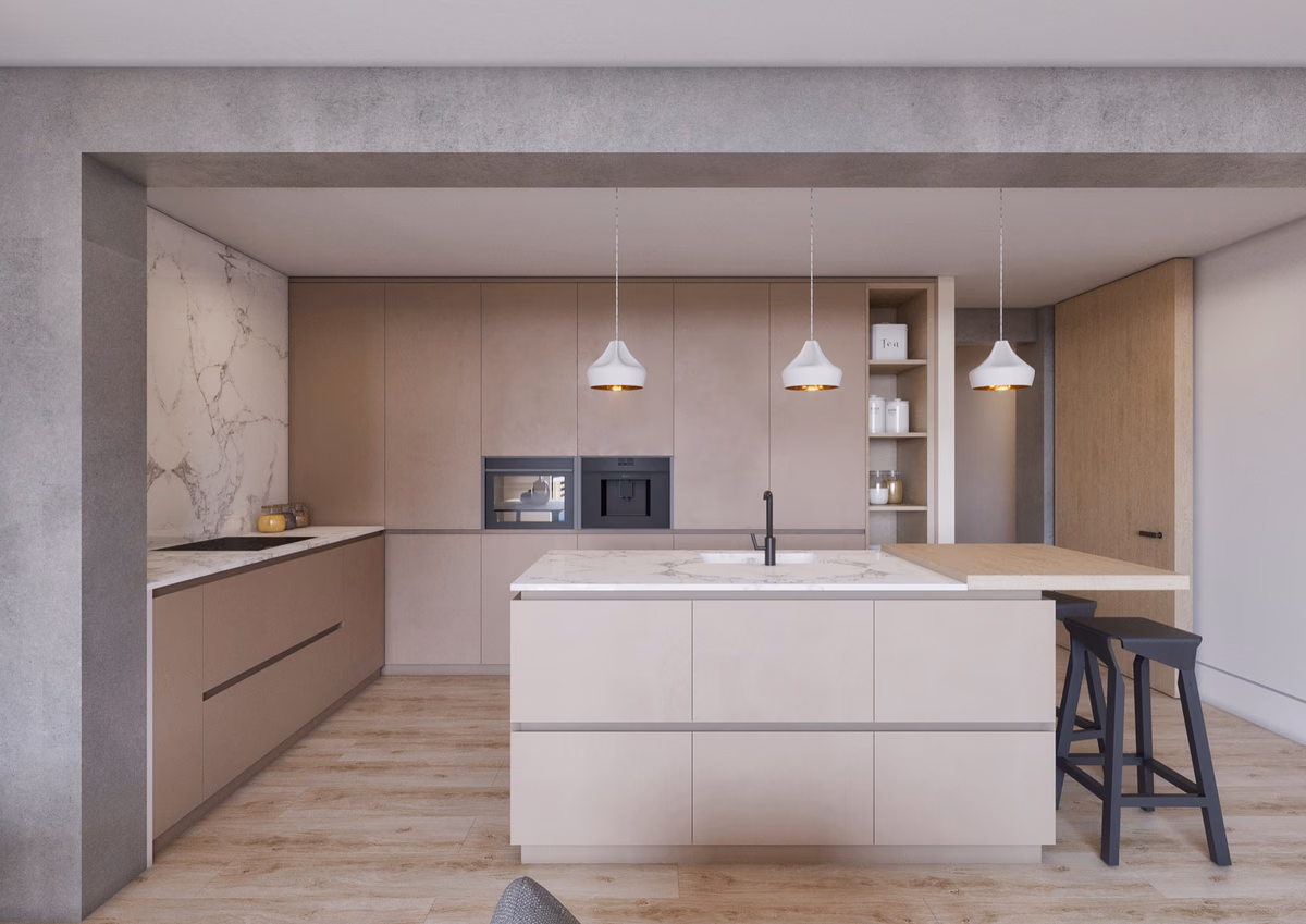 Cocina abierta con isla central integrada en el salón.